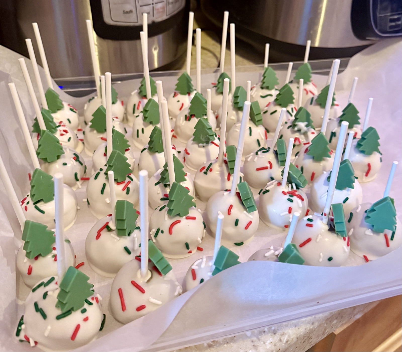 Christmas tree cake pops with red and green sprinkles