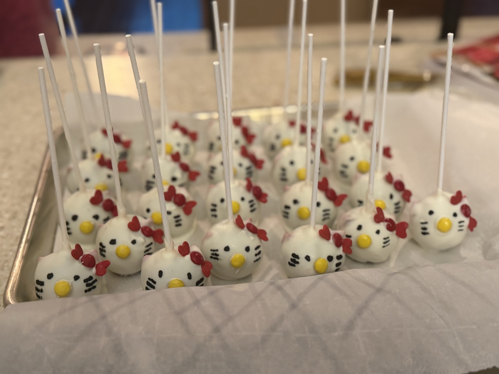 Hello Kitty cake pops on a tray