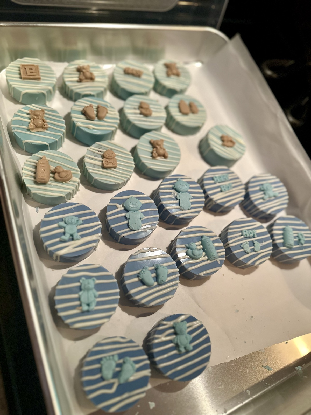 Baby shower dipped Oreos in blue with teddy bear toppers